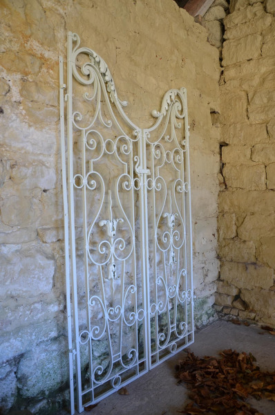 A pair of wrought iron garden gates in the Rococo taste