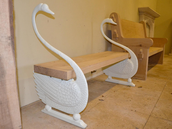 A cast iron swan bench