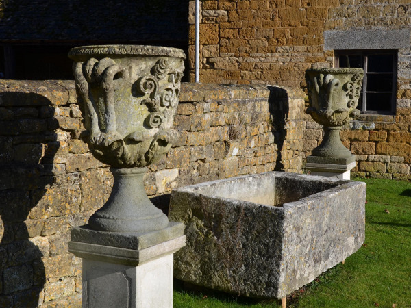 A pair of large carved Bath stone finial urns (solid)