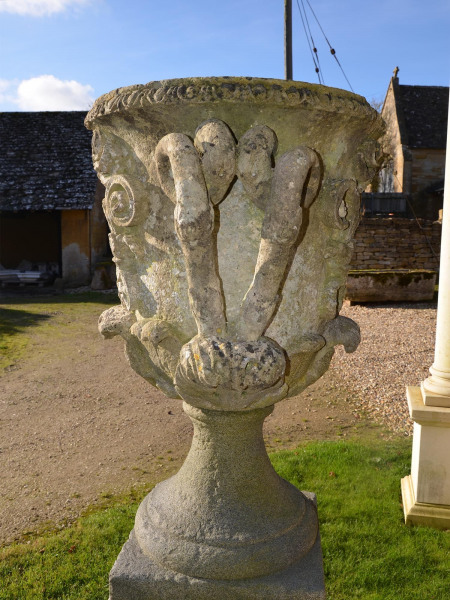 A pair of large carved Bath stone finial urns (solid)
