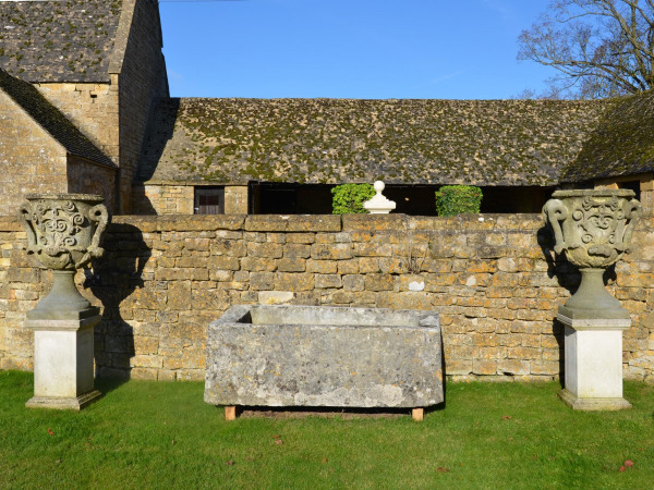 A pair of large carved Bath stone finial urns (solid)