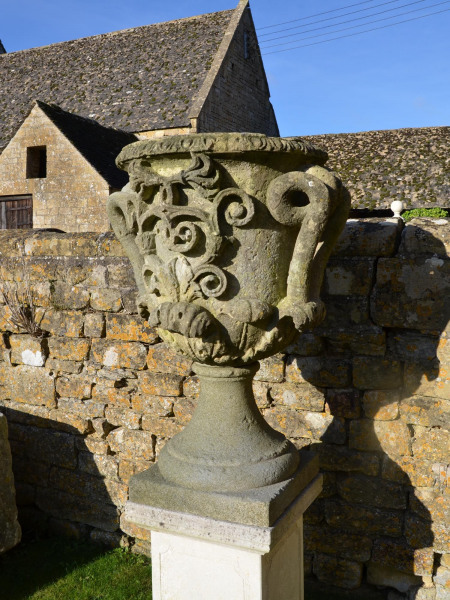 A pair of large carved Bath stone finial urns (solid)