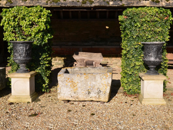 A pair of early 20th century lead urns of Campana form
