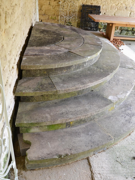 A suite of York stone steps of semi-circular form