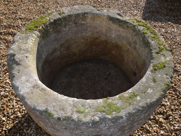 A large 18th century circular stone trough
