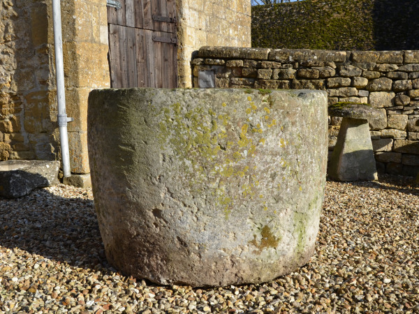 A large 18th century circular stone trough