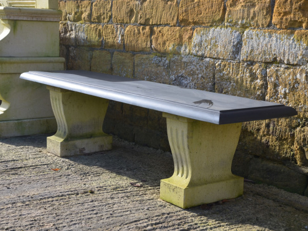 A slate topped garden bench