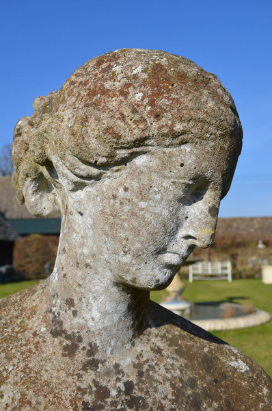 A 19th Century composition stone garden figure of Flora by Austin and Seeley