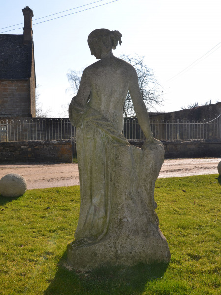 A 19th Century composition stone garden figure of Flora by Austin and Seeley