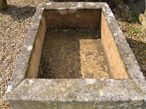 A large antique limestone trough with good weathering and patination