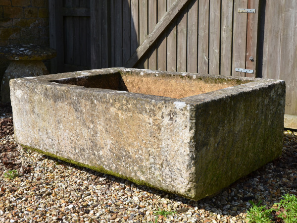 A large antique limestone trough with good weathering and patination