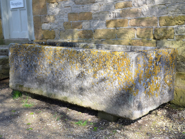A large antique limestone trough with good weathering and patination