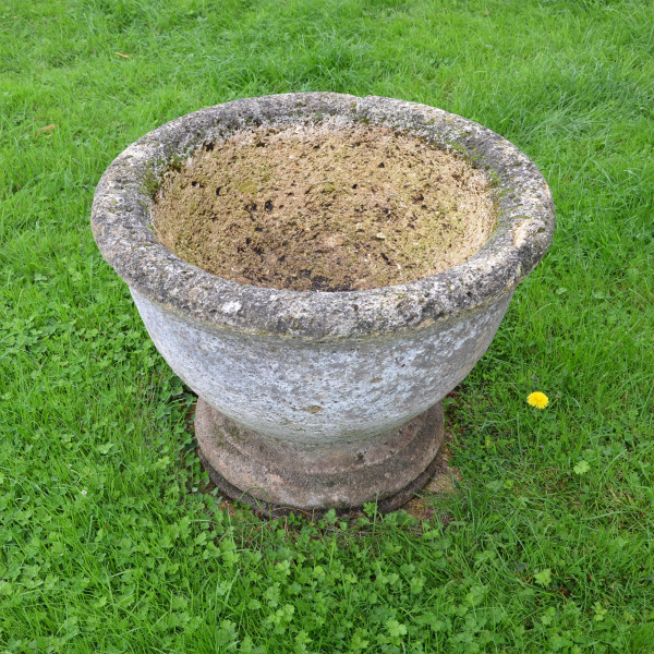 A circular stone planter