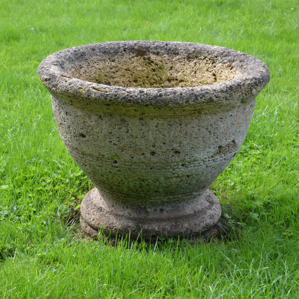 A circular stone planter