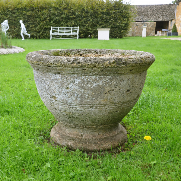 A circular stone planter