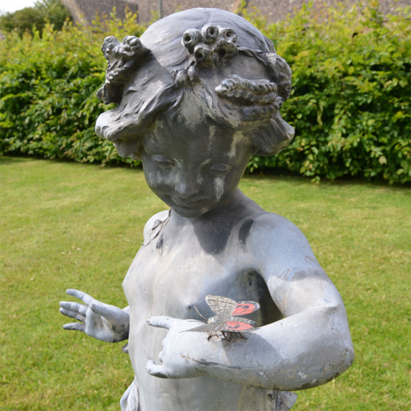 An early 20th Century lead figure of the 'Butterfly Girl'