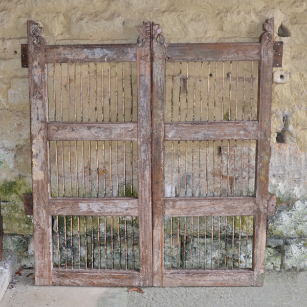 A pair of vintage wood and iron garden gates