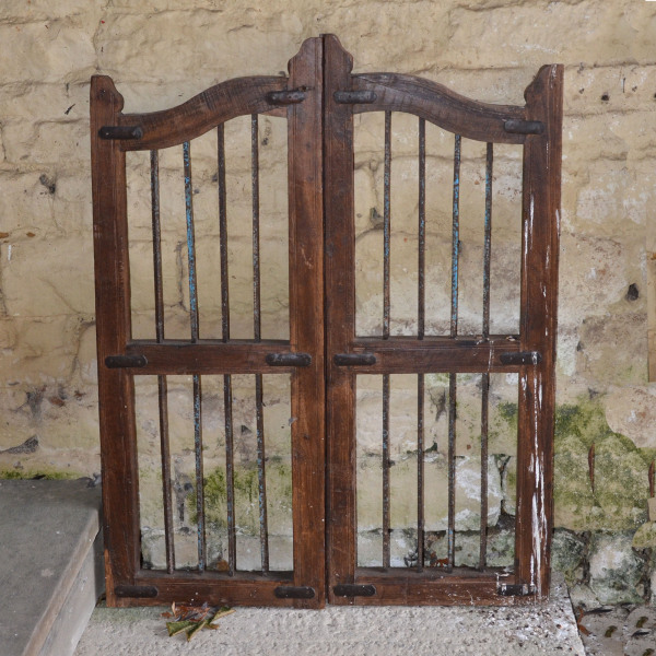 A pair of vintage wood and iron garden gates