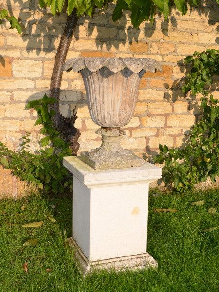 A pair of Austin and Seeley composition stone urns