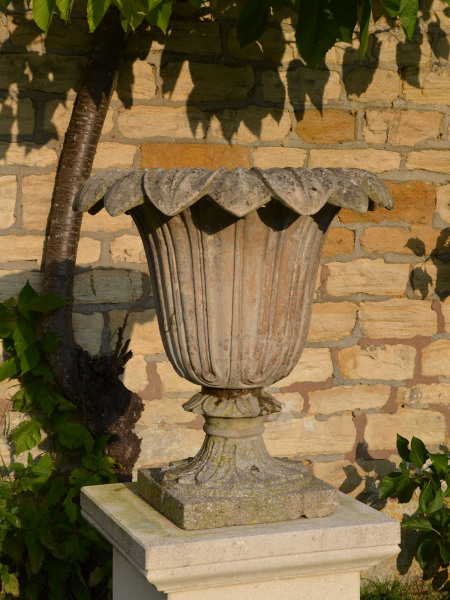 A pair of Austin and Seeley composition stone urns