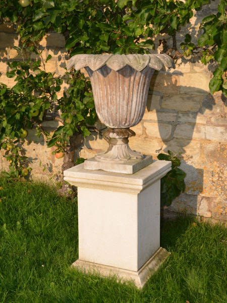 A pair of Austin and Seeley composition stone urns