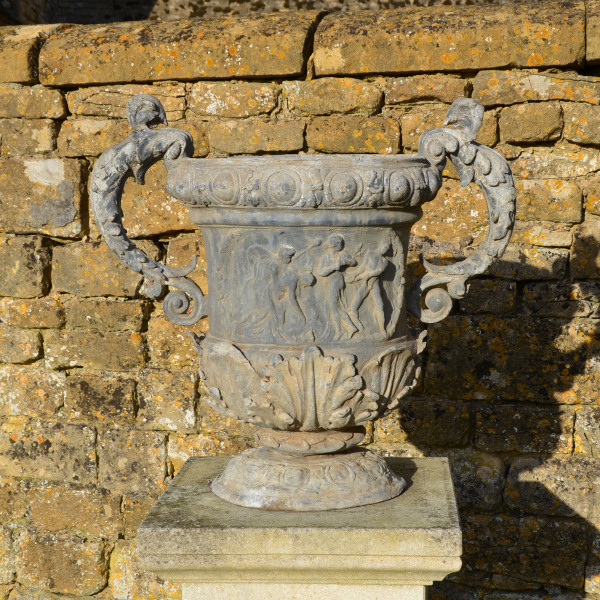 A large pair of ornate lead urns 