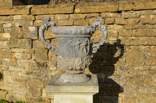 A large pair of ornate lead urns 