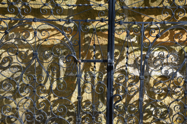 A pair of decorative wrought iron gates
