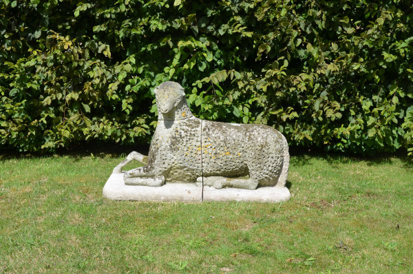 A large carved natural Bath stone Folk Art sheep