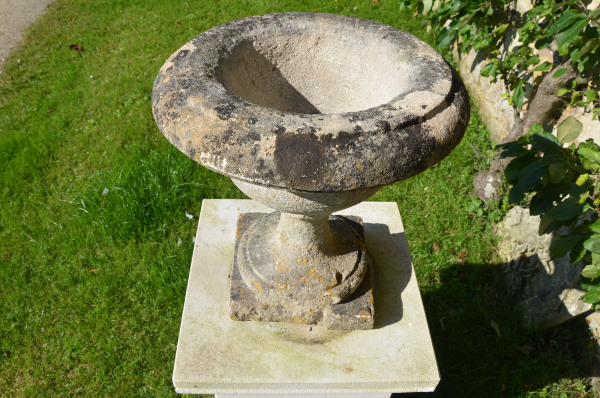 A pair of 19th century Bath stone tazza shaped urns