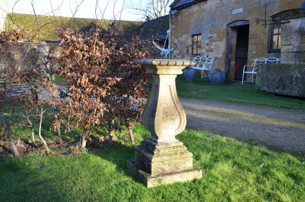A carved Bath stone sundial base