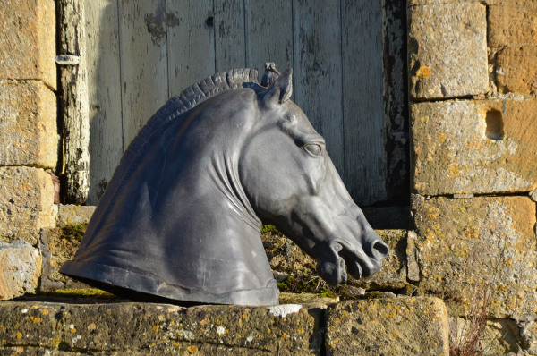 A verdigris cast bronze copy of the Roman horse head known as the ‘Medici Riccardi Horse’