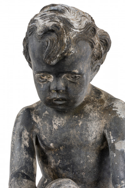  An early 20th century lead fountain in the form of a boy holding a fish