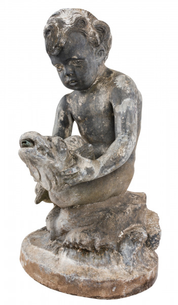  An early 20th century lead fountain in the form of a boy holding a fish