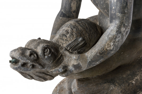  An early 20th century lead fountain in the form of a boy holding a fish