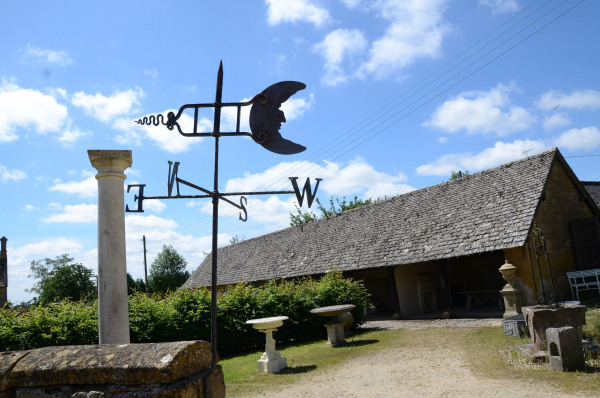 A ‘Folk Art’ weather vane having a copper Man in the Moon sail
