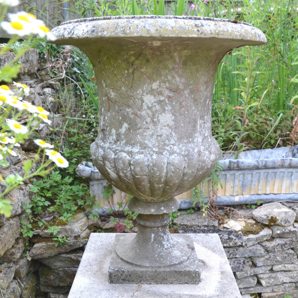 An Italian weathered white marble campana urn