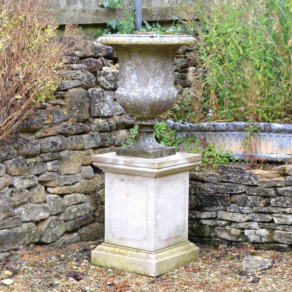An Italian weathered white marble campana urn