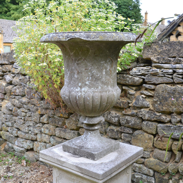 An Italian weathered white marble campana urn