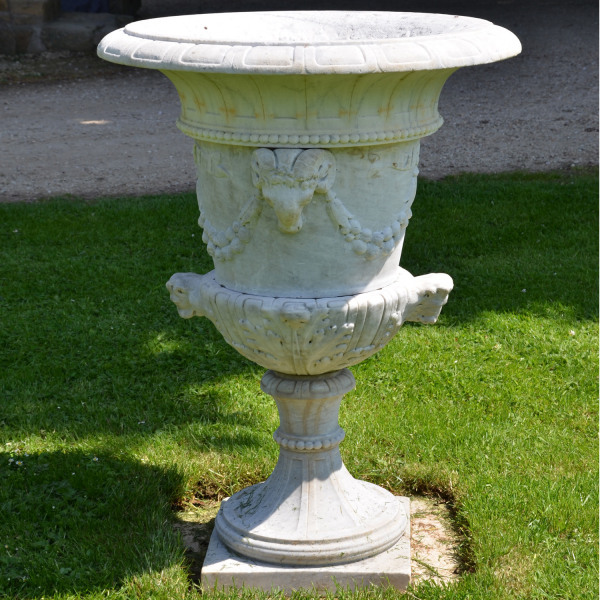 A Carved White Marble Campana Shaped Urn