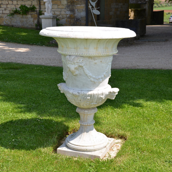 A Carved White Marble Campana Shaped Urn
