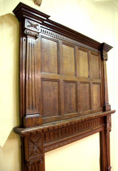 A late 19th century Oak fire surround partially made up from period elements