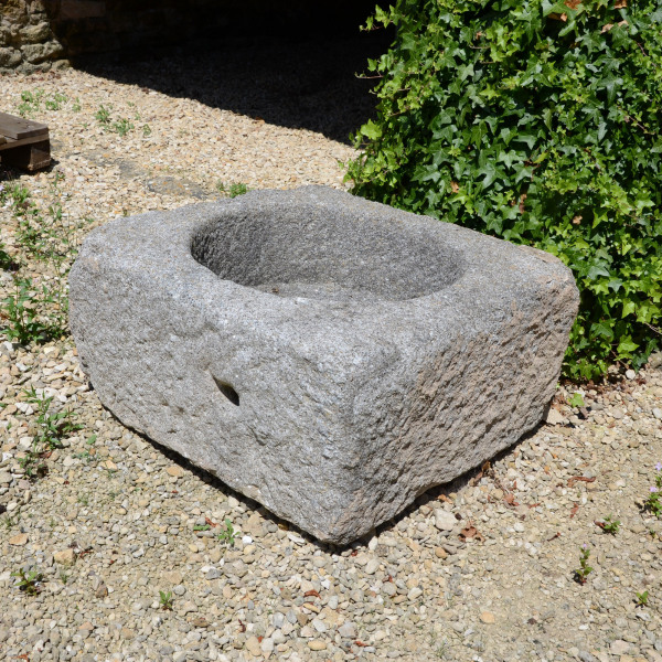 A pair of square granite planters