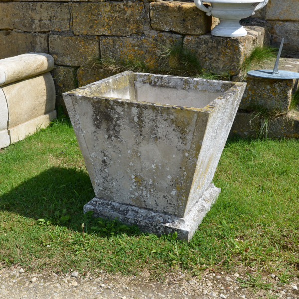 A pair of mid 20th century square stone planters of taper form 