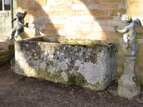 A large antique limestone trough