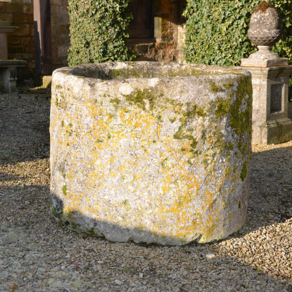 A large antique circular limestone trough