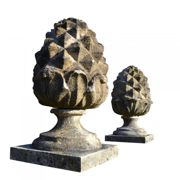 A pair of carved Bath stone pineapple finials