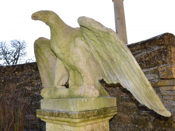 A pair of impressive carved stone eagles