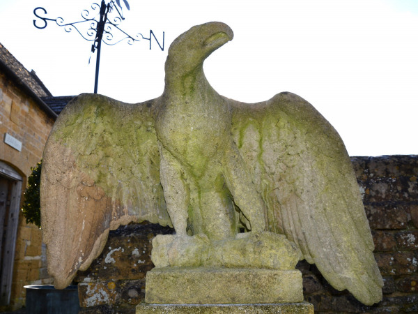 A pair of impressive carved stone eagles