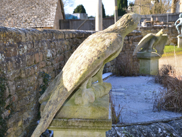 A pair of impressive carved stone eagles